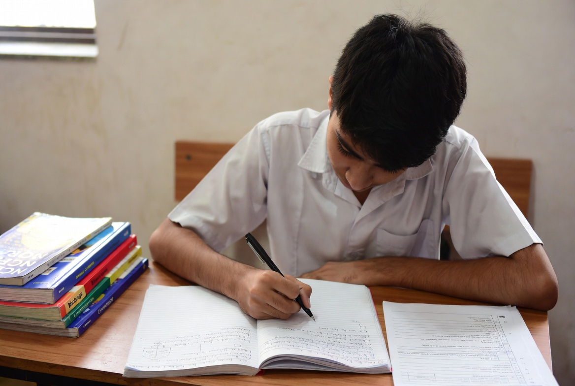 Student practicing how to improve answer writing in CBSE Board Exams with structured format